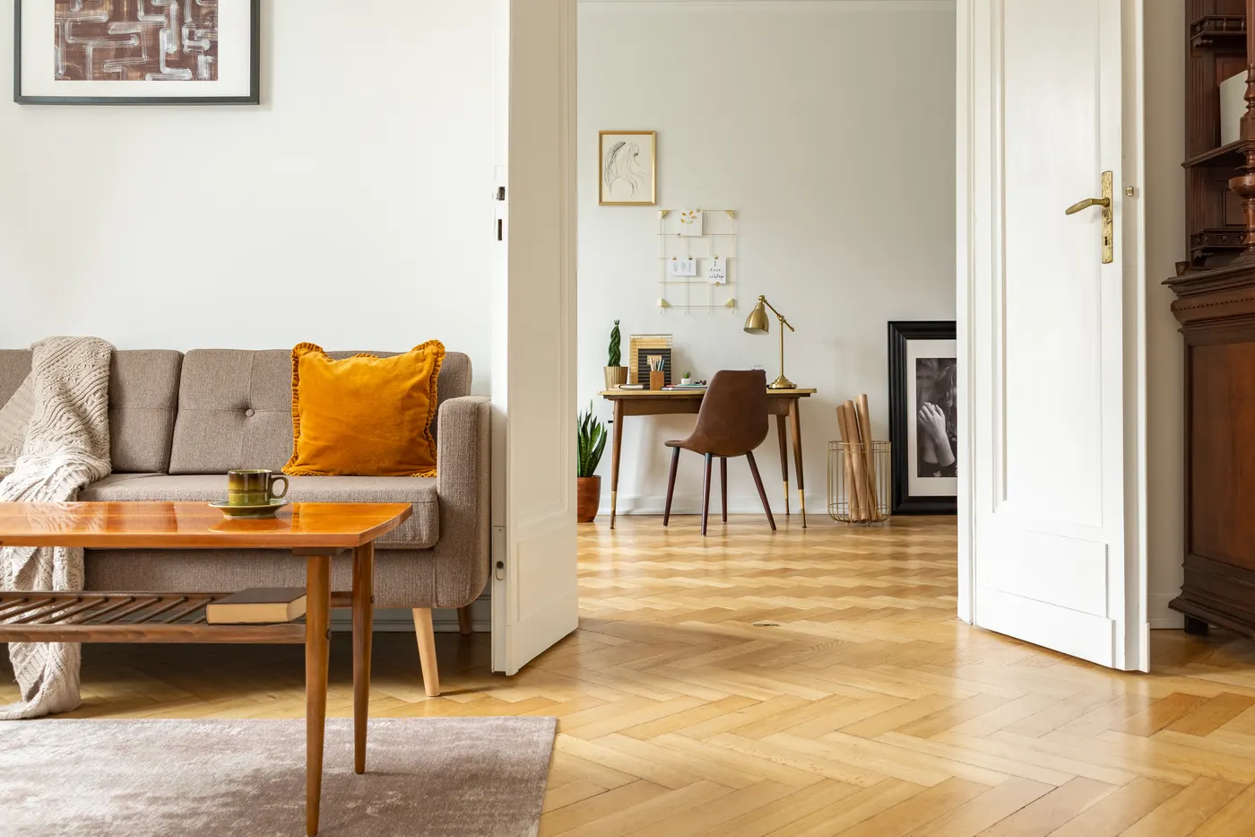 A finished herringbone wood floor in a living room